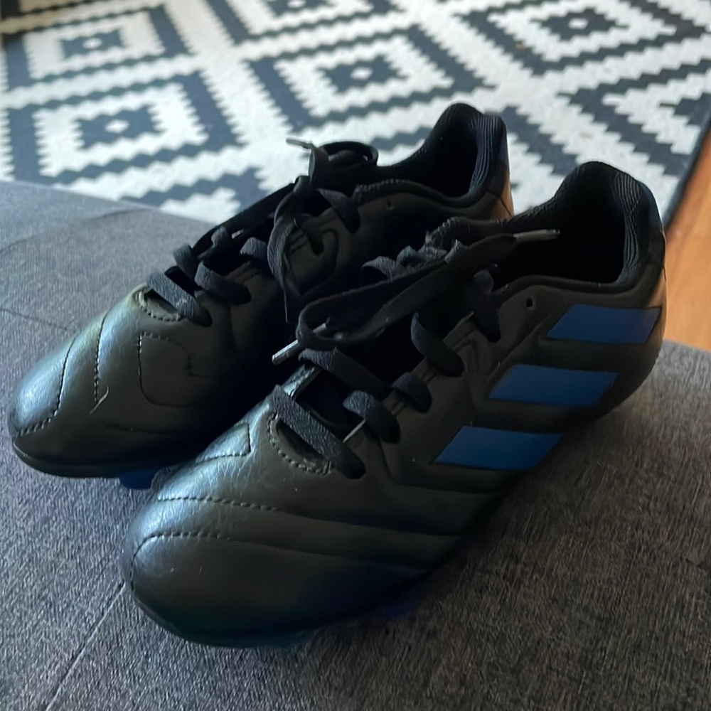 Like new kids Adidas soccer cleats black and blue size 1.5